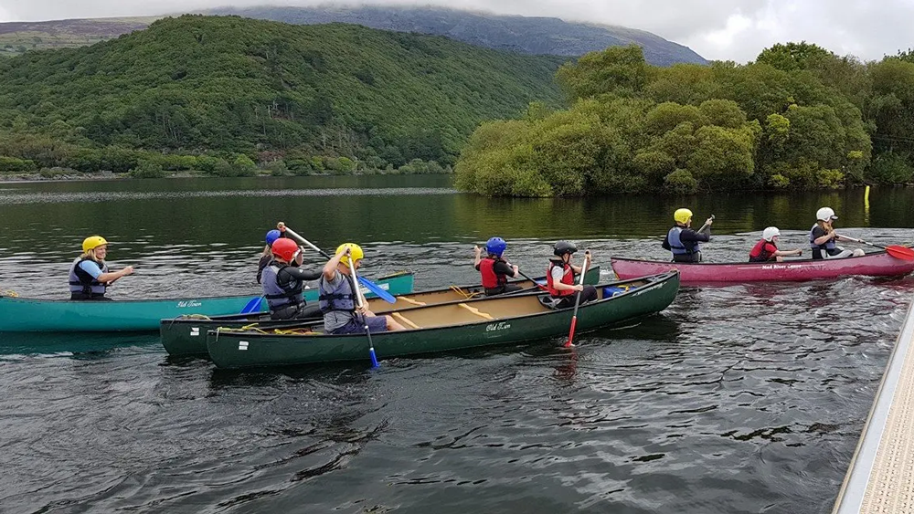 Children kayaking at the Conway Centre in North Wales