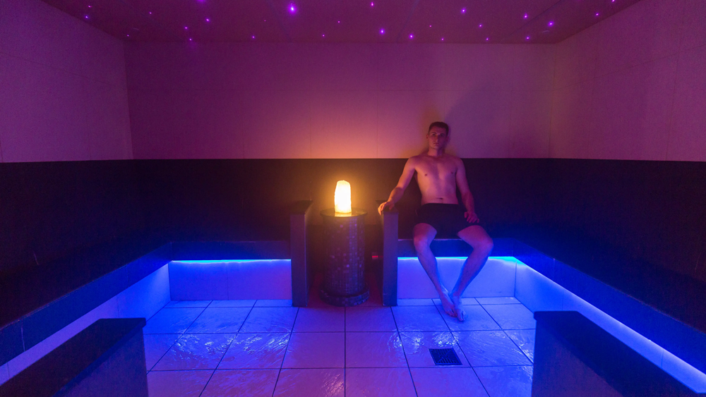 A man sat in the steam room at Brynteg holiday park