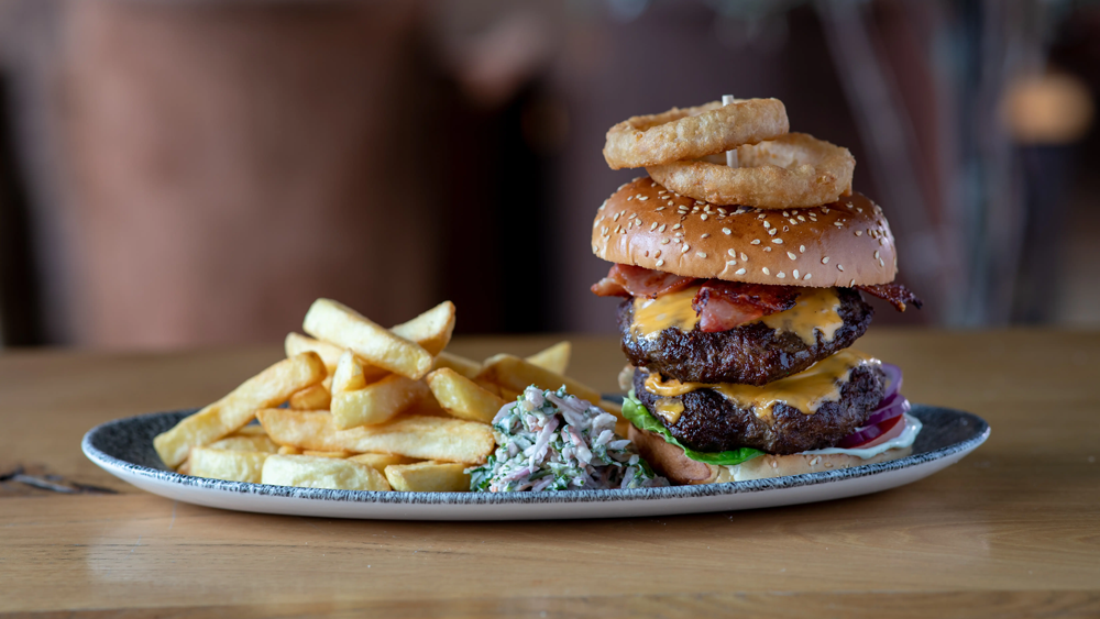 Cheese and bacon burger and chips
