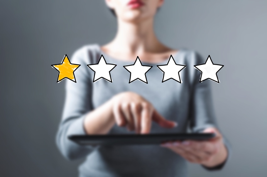 One star rating with woman using a tablet