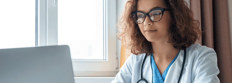 doctor working on a laptop