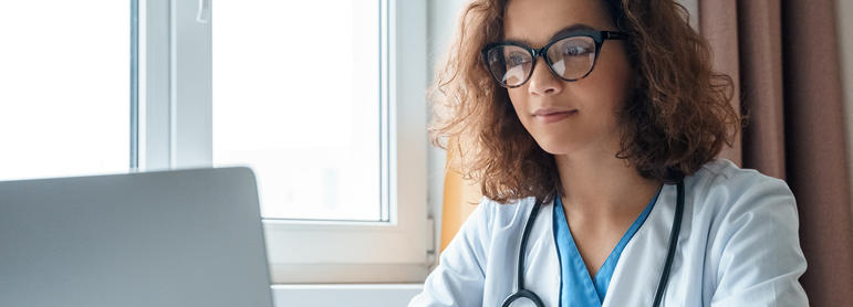 doctor working on a laptop