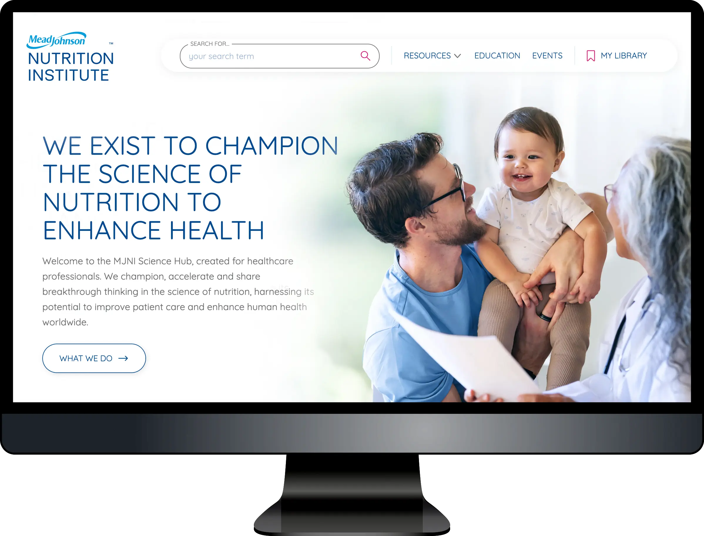 Computer monitor displaying MeadJohnson Nutrition Institute website homepage with family photo and mission statement about championing nutrition science