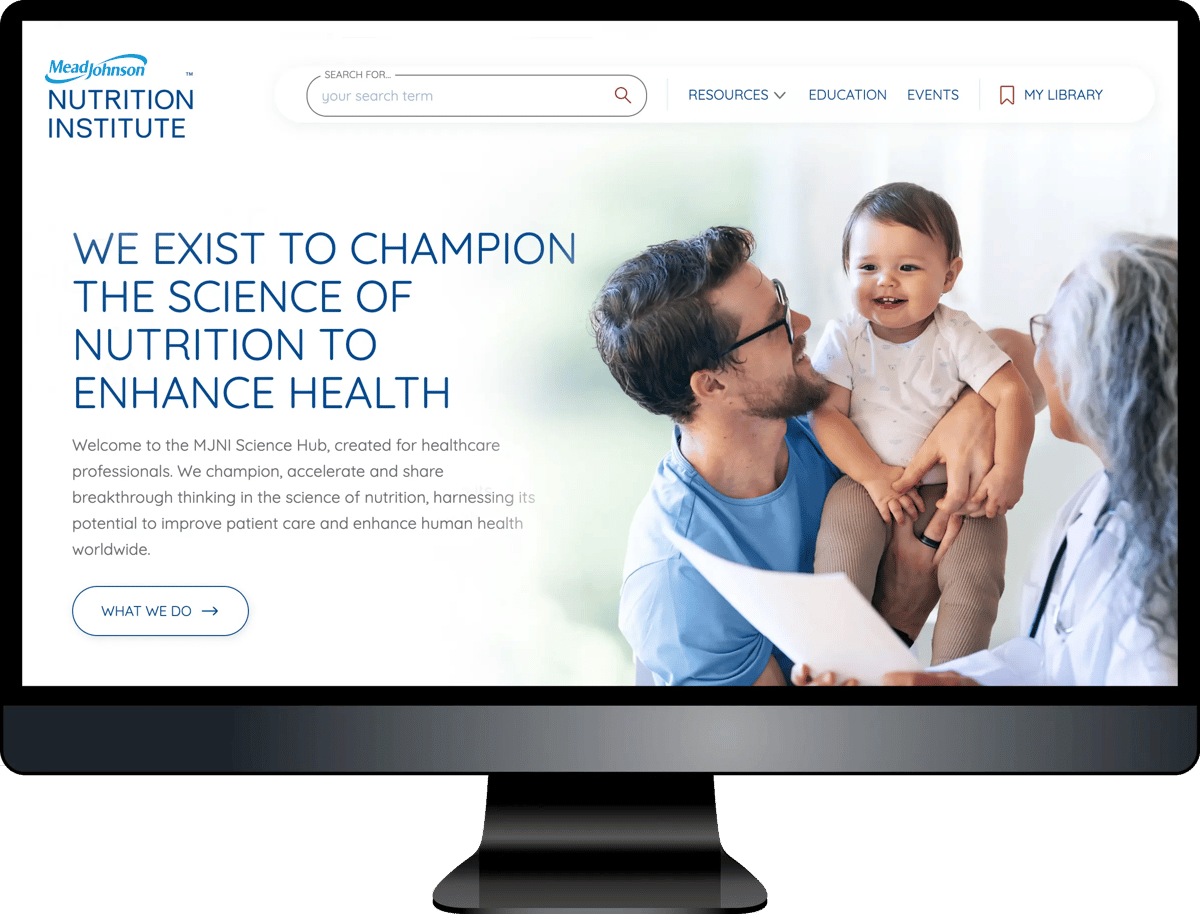Computer monitor displaying MeadJohnson Nutrition Institute website homepage with family photo and mission statement about championing nutrition science
