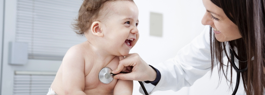 pediatrician listening to a laughing baby