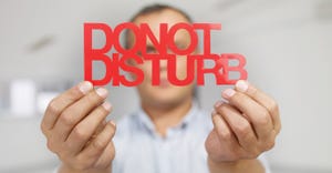 Man showing do not disturb sign