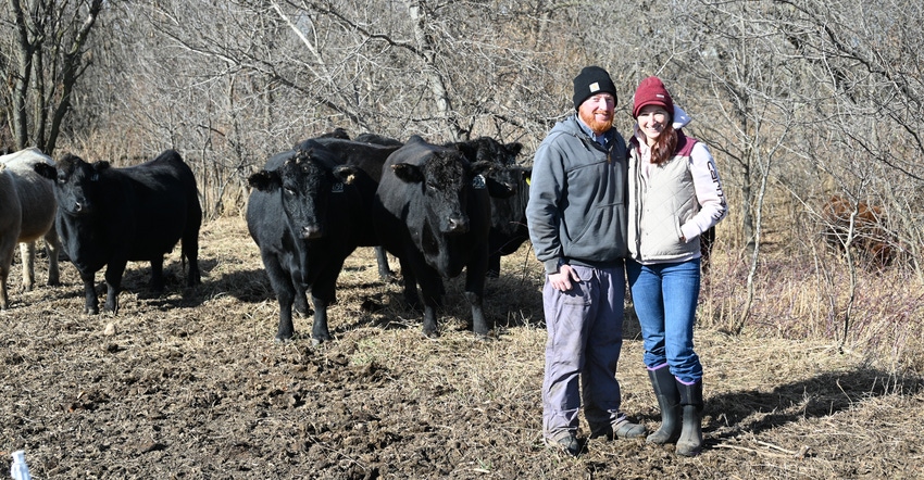 Northeast Iowa cattle producers Josh and Lacey Zuck in field with cattle