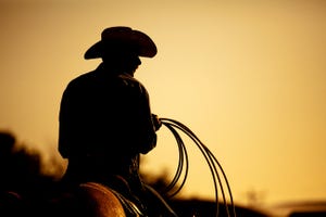 Cowboy silhouette at sunset