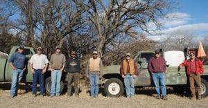 A few members of the Bristow, Neb. area crew pose in front of the trucks they purchased to help on prescribed burns