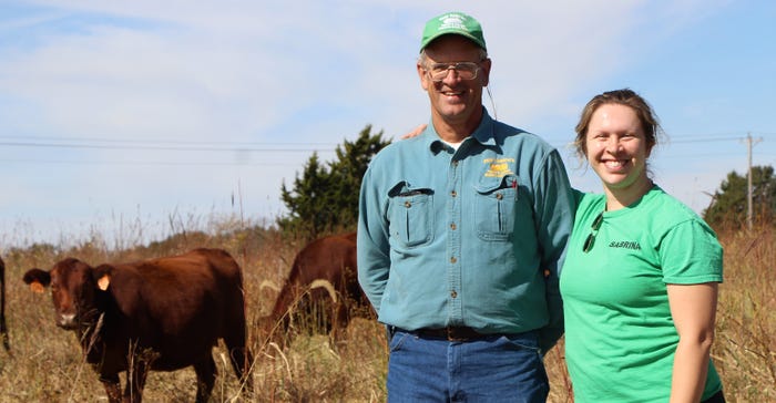 Harry Cope resonates with his daughter Sabrina Cope in field with cow in background