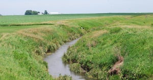 stream in middle of farmland