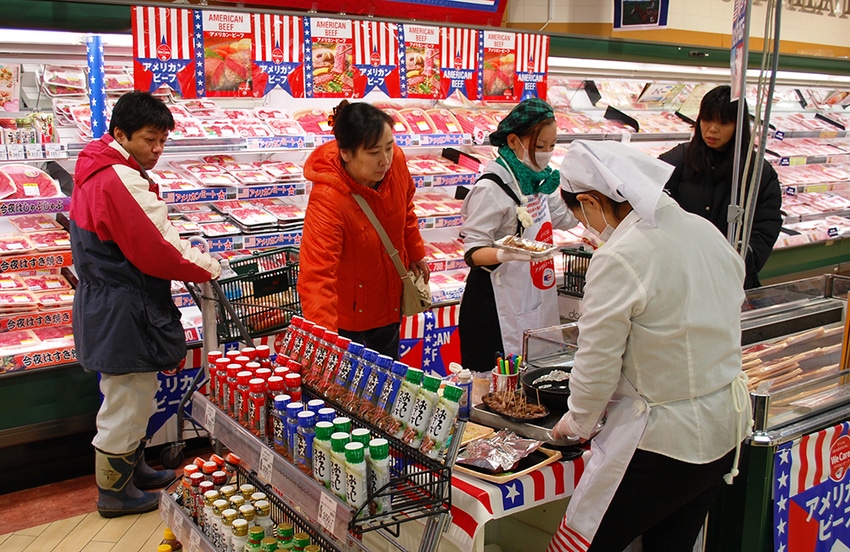 Customers sample U.S. beef at Tokyo supermarket