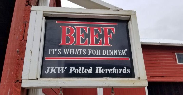 An outdoor sign at JKW Polled Herefords reads 'Beef, it's what's for dinner'