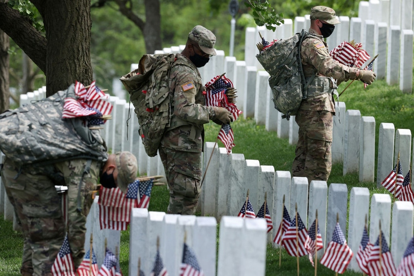 Soldiers place flags at Arlington National Cemetery Soldiers place flags at Arlington National Cemetery