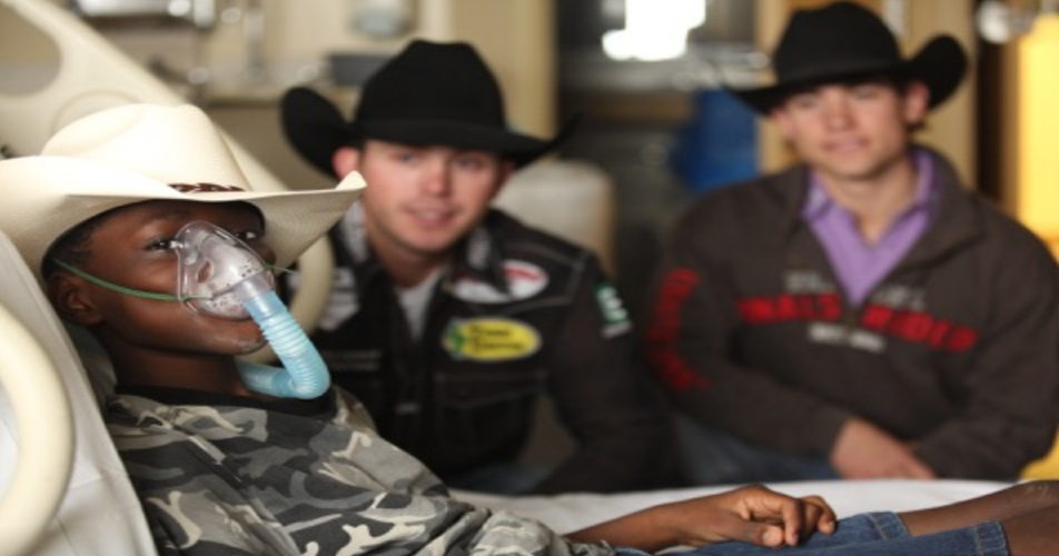 Cowboys Who Care Foundation gifts cowboy hats to kids with cancer