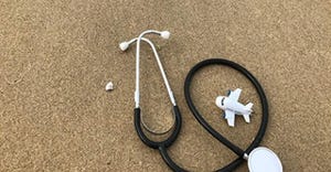 stethoscope and a plane on the floor stethoscope and a plane on the floor