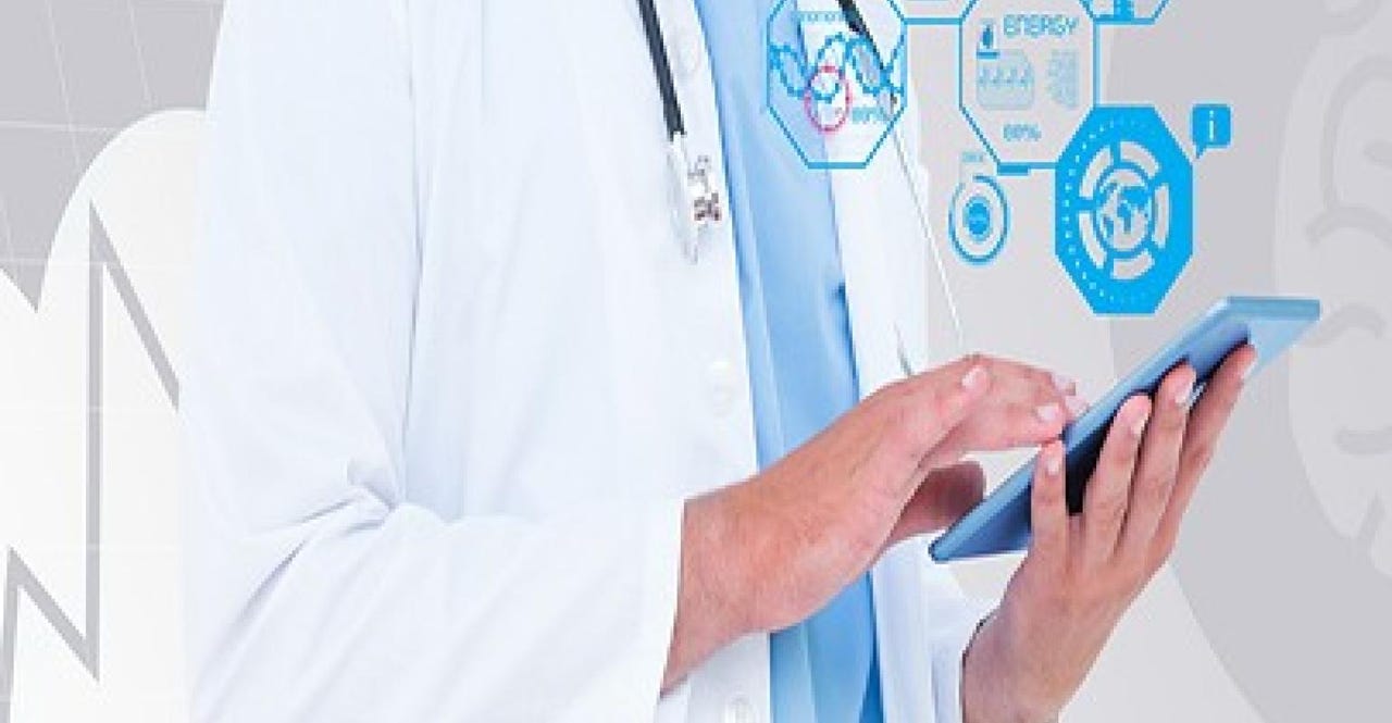 doctor holding a tablet with floating graphics doctor holding a tablet with floating graphics