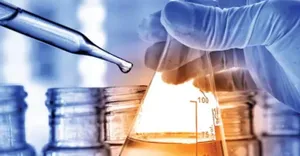 doctor dropping liquid in a test tube doctor dropping liquid in a test tube