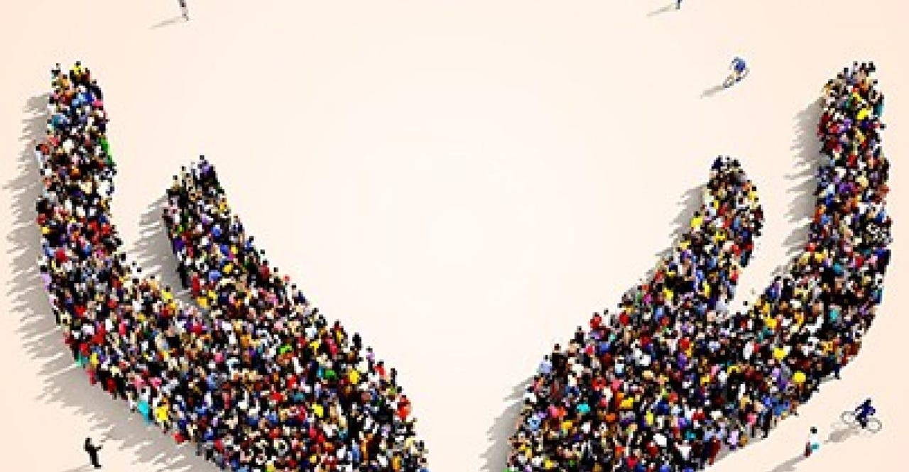 Crowd of people forming shape of of a hand Crowd of people forming shape of of a hand