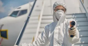 hazmat-suit-wearing-female-outside-aircraft.jpg hazmat-suit-wearing-female-outside-aircraft.jpg