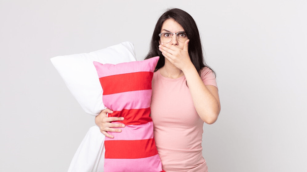 Female with hand over mouth