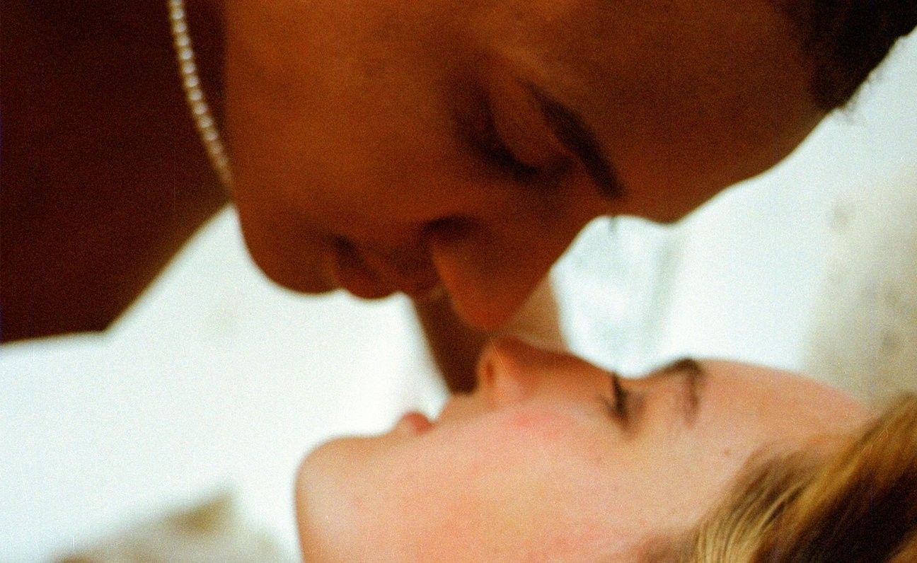 A Couple Making Love on Bed