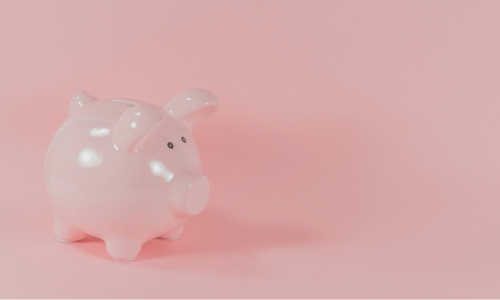 Raisin UK-pink piggy bank on soft pink background