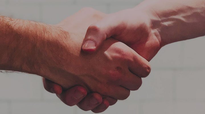 Raisin UK-Handshake between two people