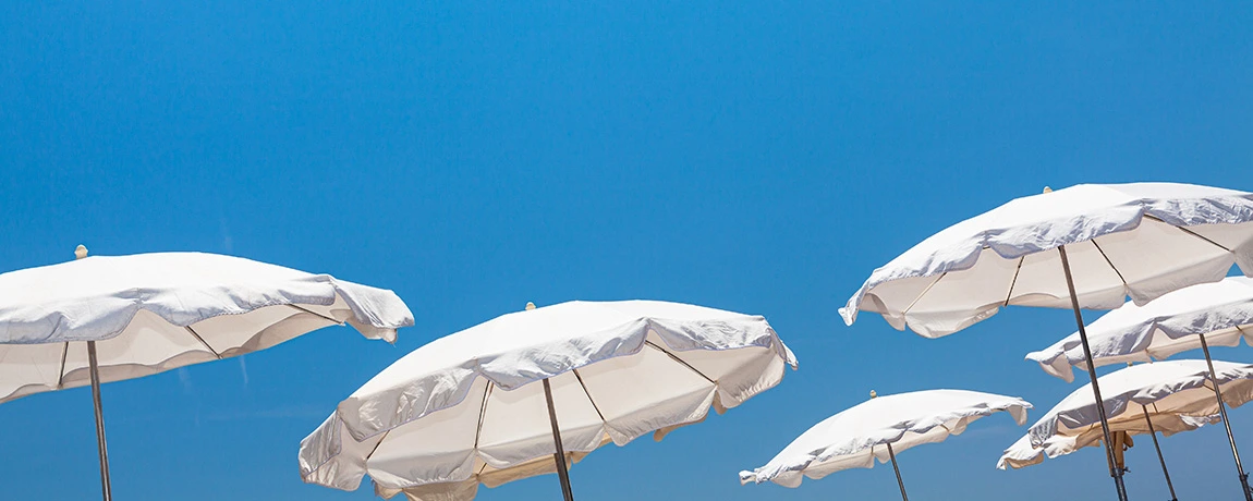 A sunny beach scene with umbrellas