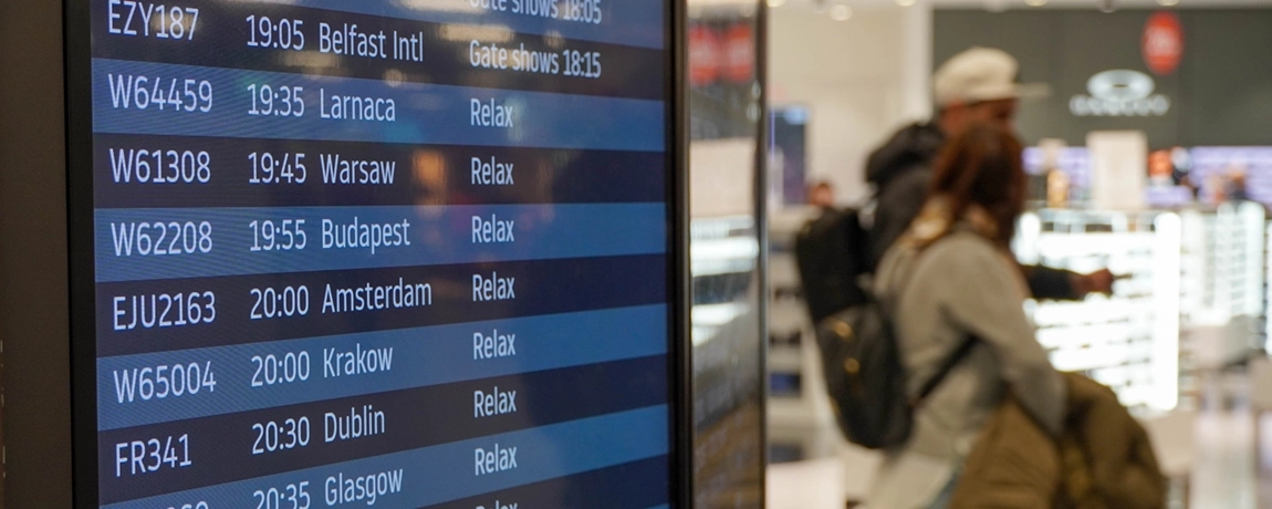 departures-board-and-passengers.webp