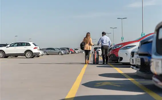 Two people walking on terminal car park 2 rooftop
