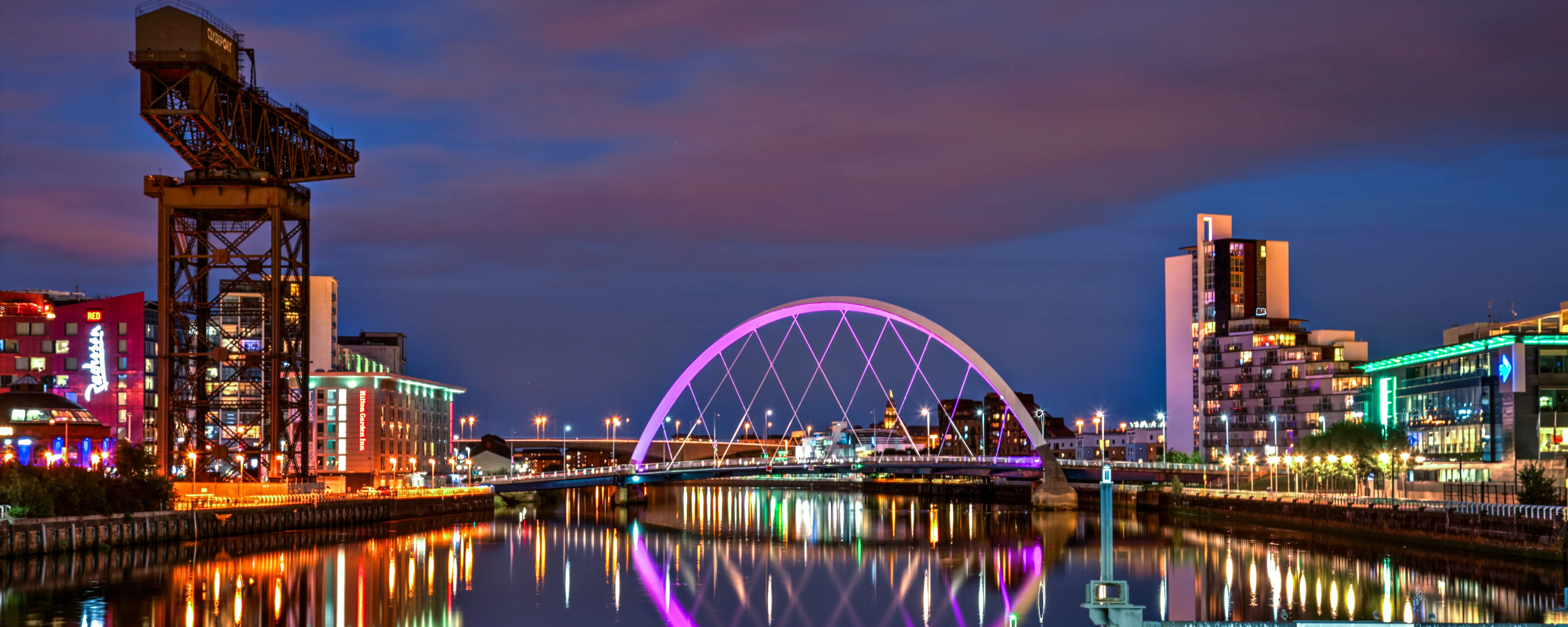 Clyde-Arch-lit-up-purple-at-night-Glasgow-Scotland.webp