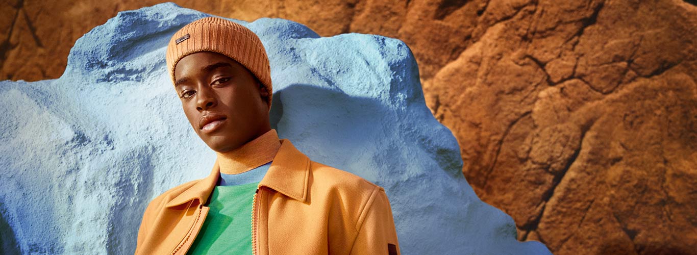 Orange jacket and hat paired with a green top, for Hugo Boss's autumn campaign.