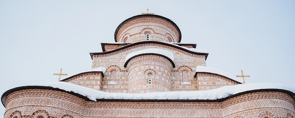 Orthodox church with a snowy roof in Pristina, Kosovo