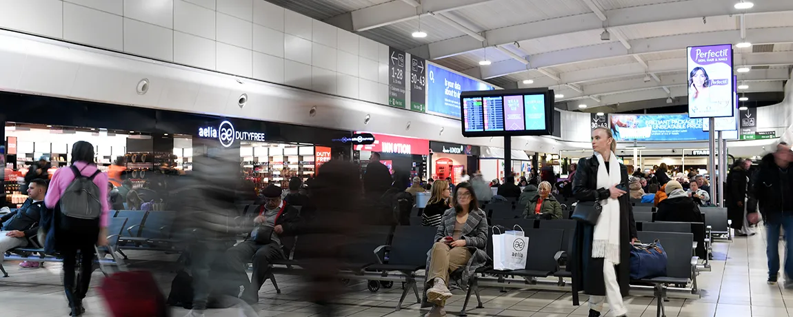 passenger walking in departure lounge at lla.webp