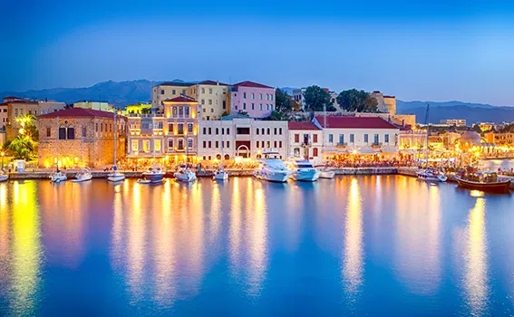 Lit up harbor in Chania, Greece.
