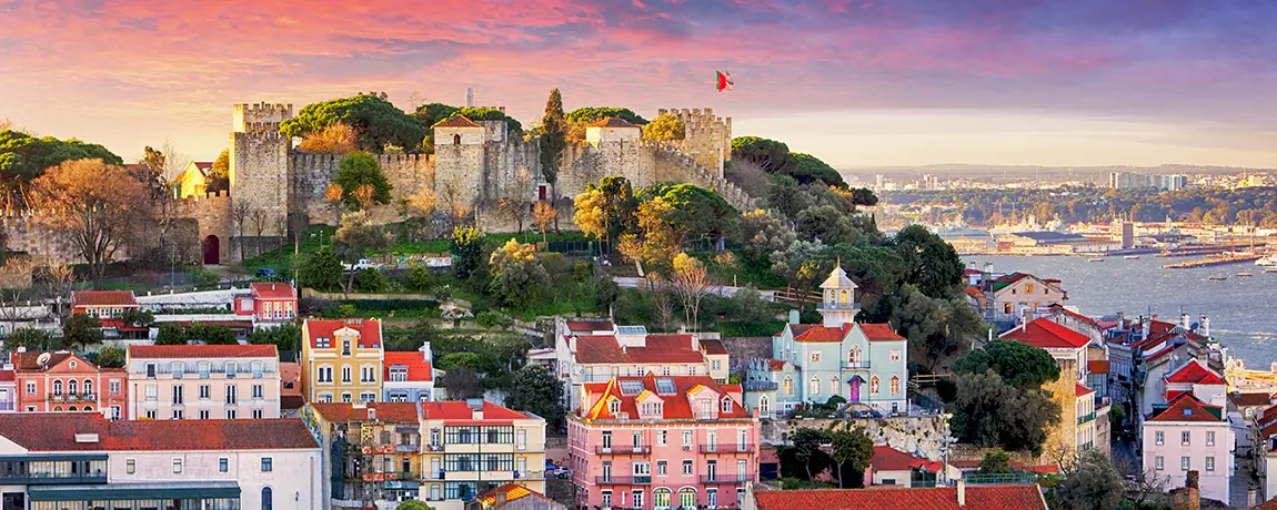 Lisbon-Portugal-at-sunset-with-Sao-Jorge-Castle.webp