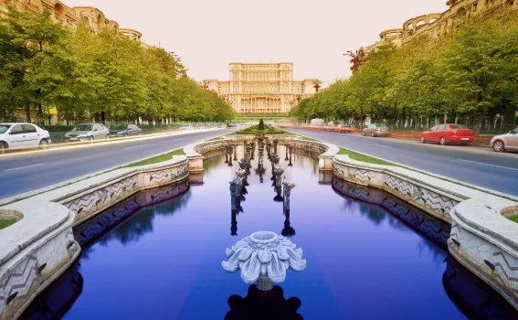 Clear water leading up to a building in Bucharest, Romania