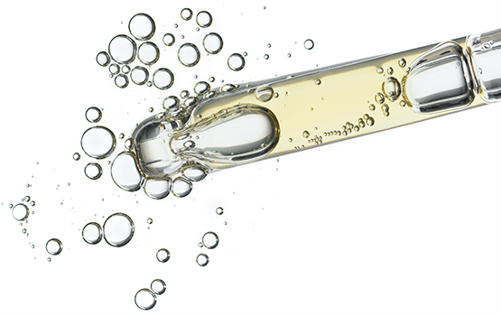 Boccetta di vetro con liquido e bolle