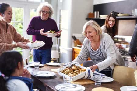 Family Preparing to Have Food at the Dining Table