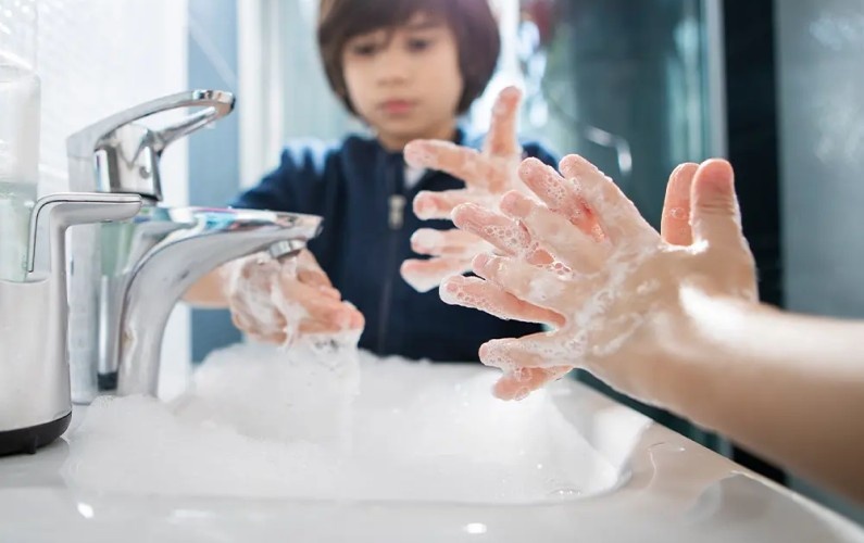 Children washing their hands