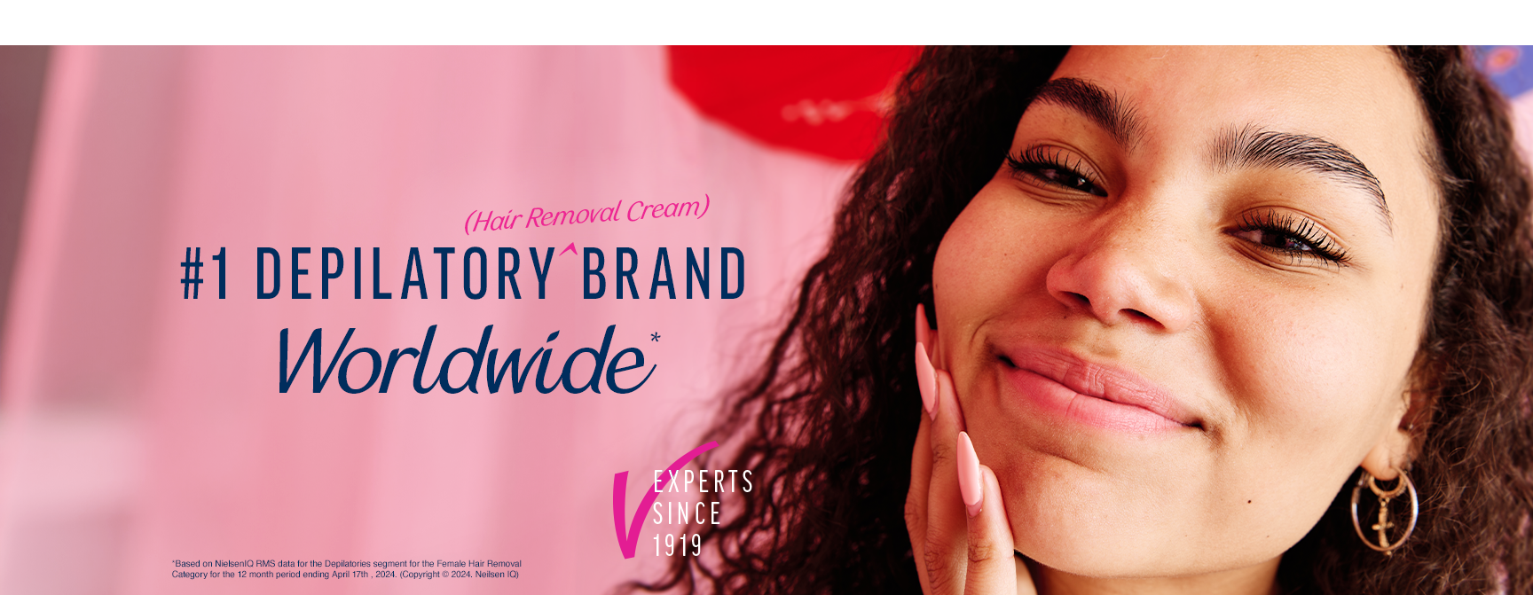 Close-up of a smiling woman with text proclaiming Veet as the "#1 Depilatory Brand Worldwide."