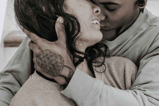 Couple exploring intimacy and sex from behind