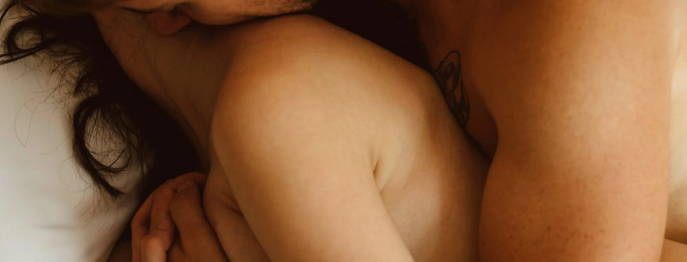 Lubes collection - couple lying and hugging from back banner