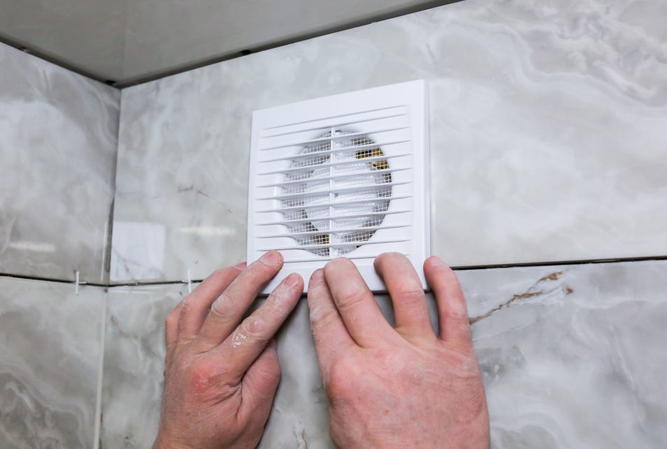 a hand a bathroom vent