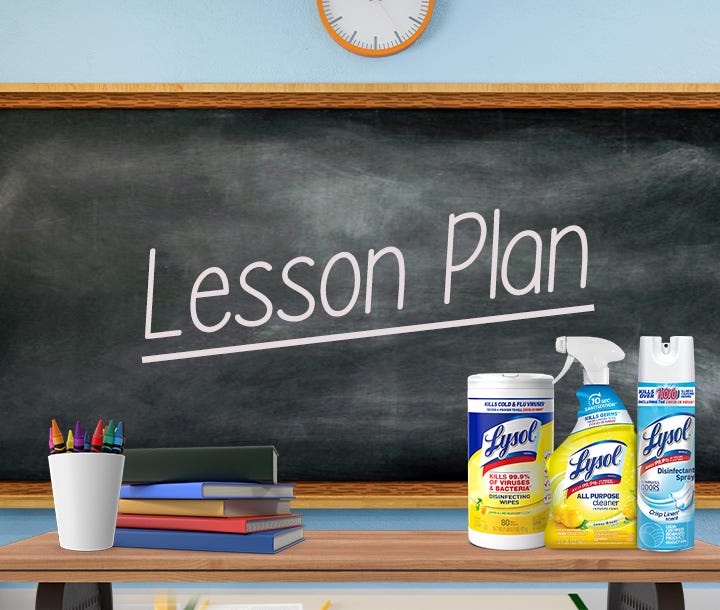Classroom chalkboard with "Lesson Plan" text and cleaning products displayed in front.