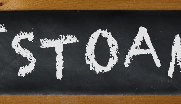 Cartoon blackboard with chalk letters spelling "otstoame"