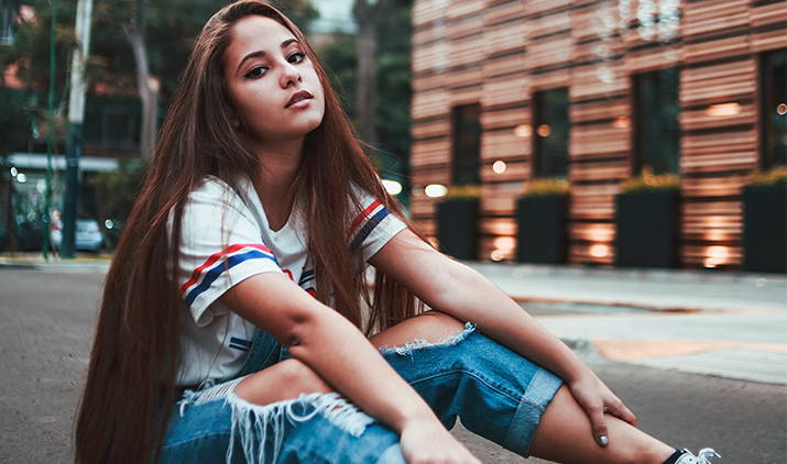 young woman posing in the street