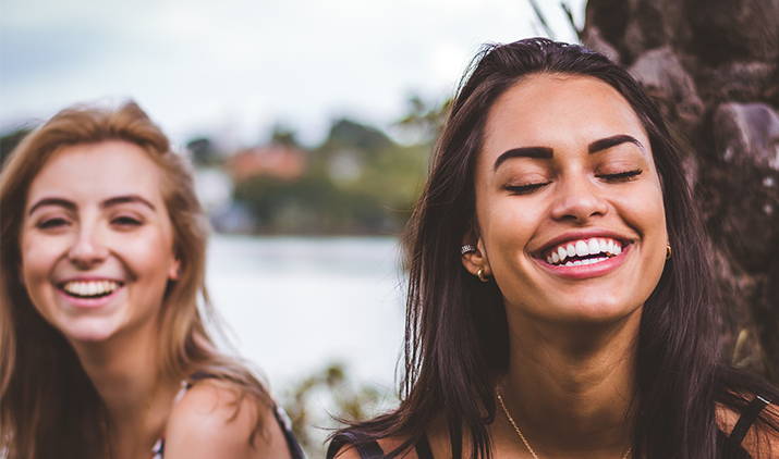 two young woman laughing
