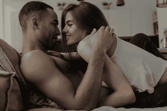 Couple building tension with foreplay